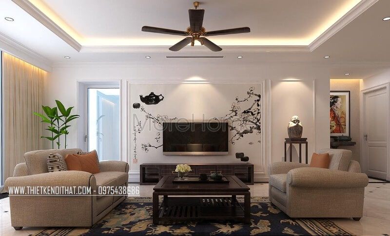 Phòng khách chung cư được trang trí bằng một kệ ti vi gỗ óc chó cao cấp.